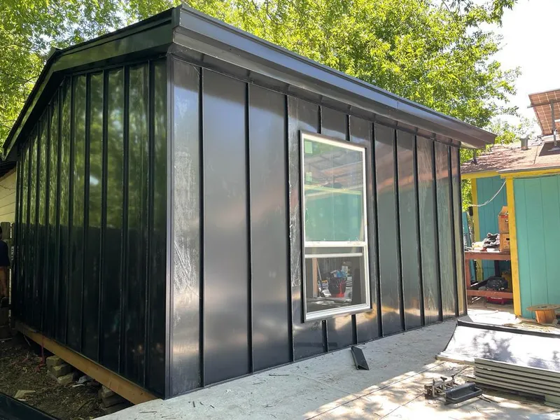 Black standing seam metal wall panels for Roof Inspection in Belvidere