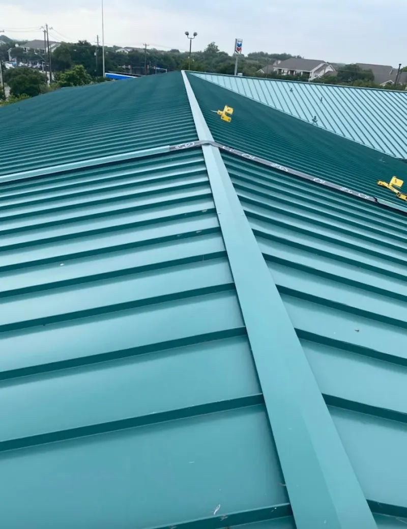 Green commercial metal roof ridge and valley for Metal Roof Repair in Belvidere